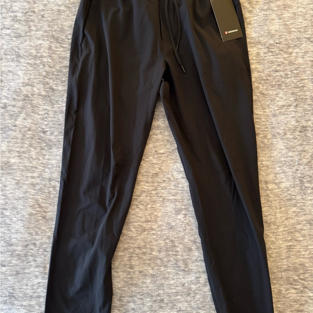 Never worn, with tags, Men’s Lululemon Black Joggers, currently selling for $118